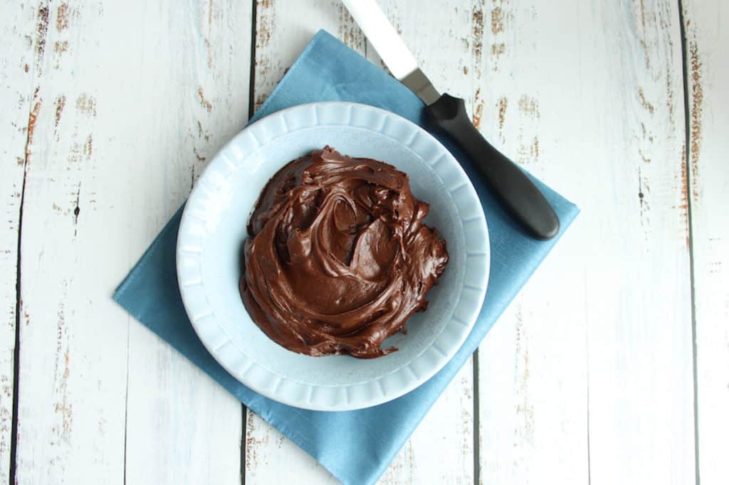 chocolate frosting in blue bowl