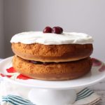 White Almond Sour Cream Cake on cake stand