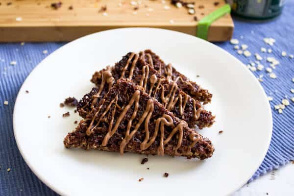 3 chocolate oat slice on a white plate