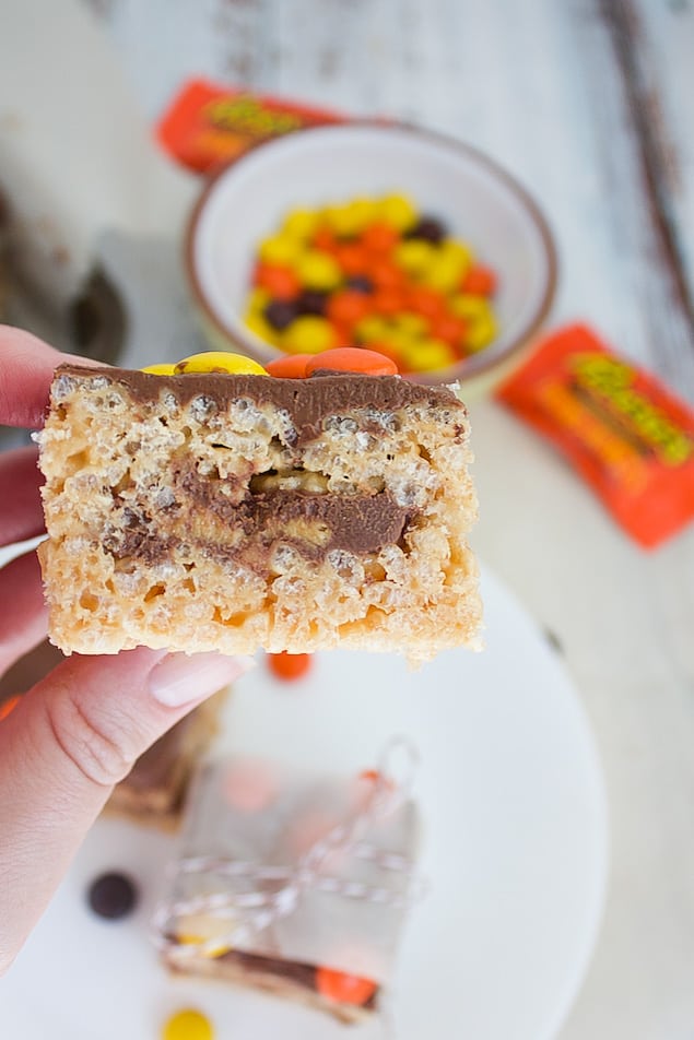 Close up of rice krispie treat stuffed with peanut butter cup