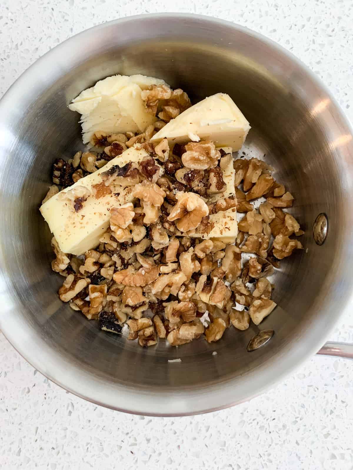 walnuts and butter in small saucepan