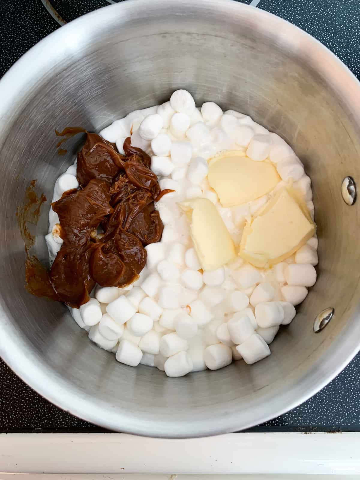 marshmallows, butter and dulce de leche in a pot