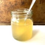 Glass jar of pineapple ginger syrup.