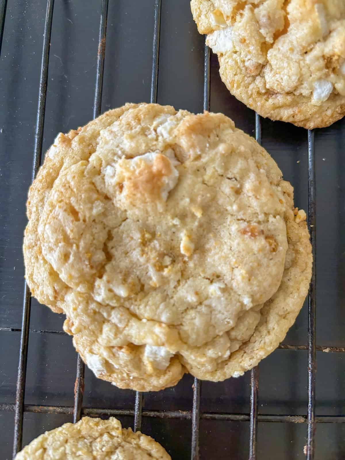 Lemon meringue pie cookie on a wire rack.