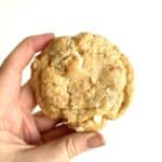 Woman's hand holds a lemon pie cookie.