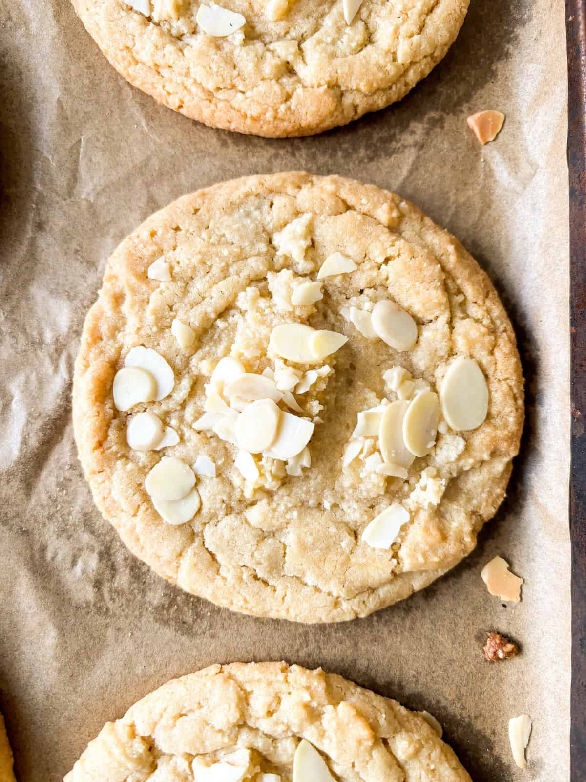 Almond croissant cookies on a baking sheet.