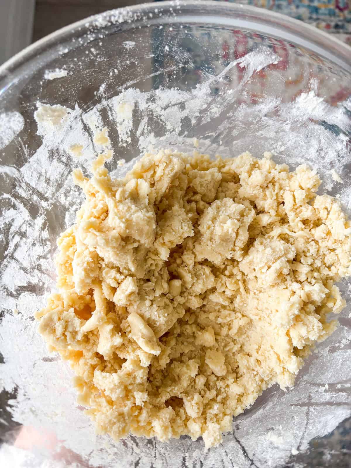 cinnamon shortbread dough in a clear mixing bowl
