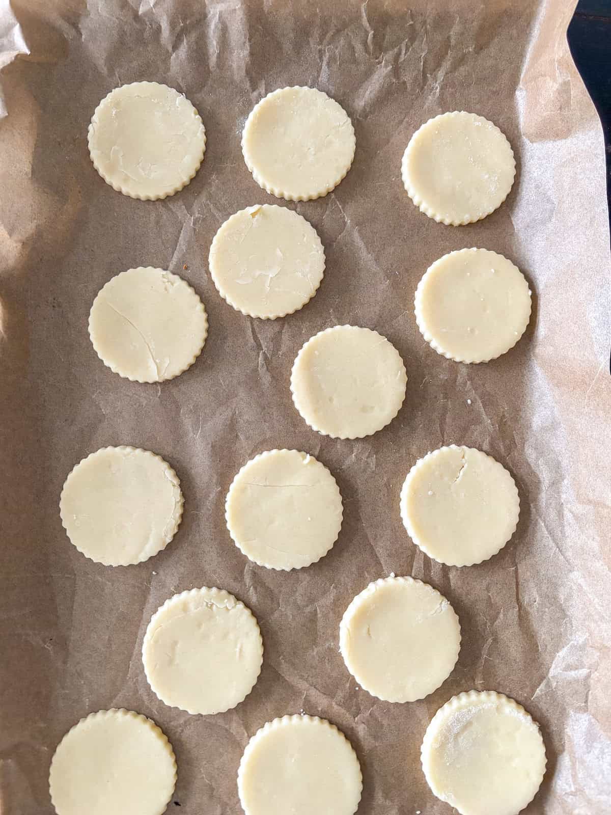 shortbread cookie cutouts on a cookie sheet