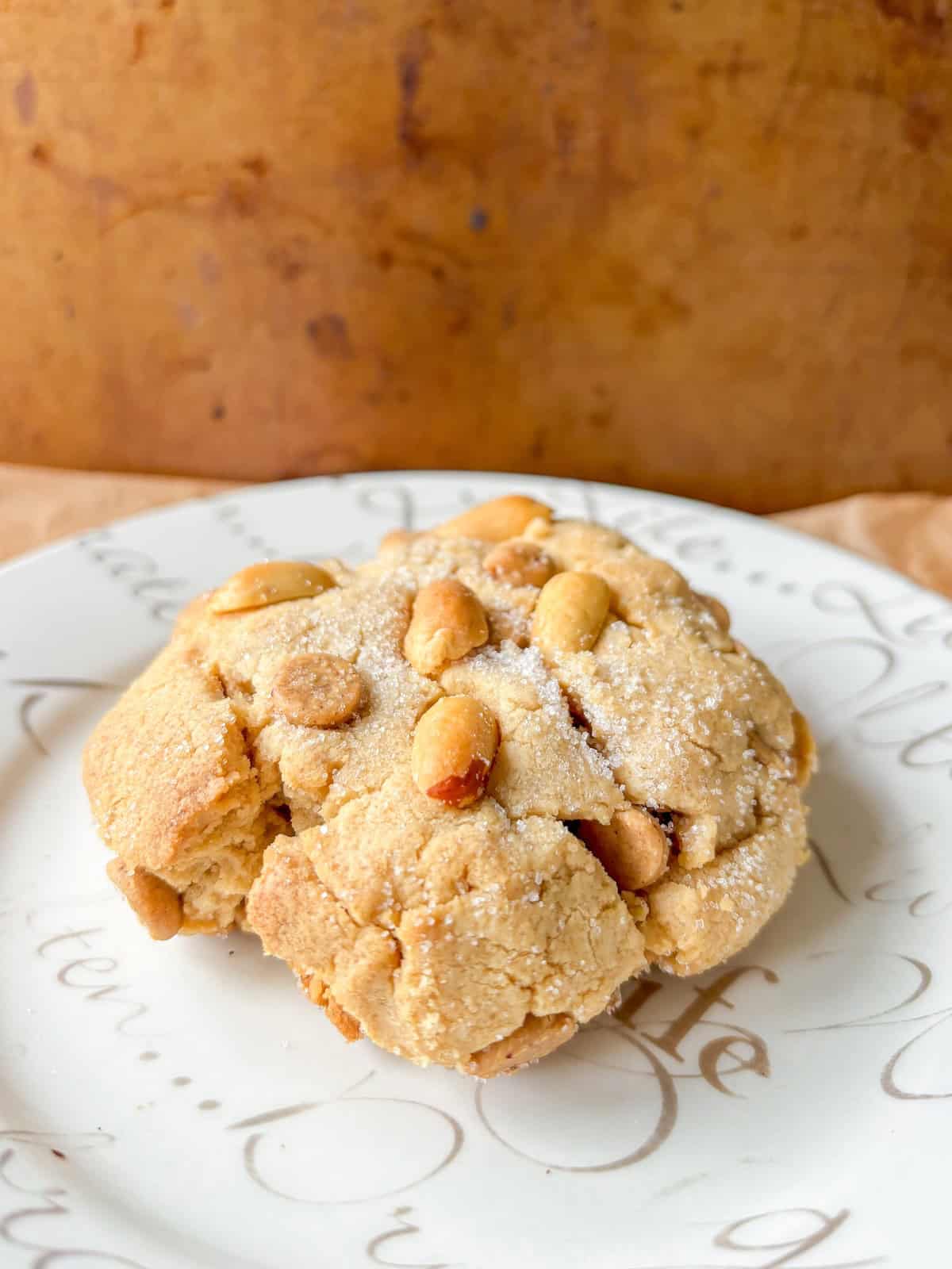 one peanut butter cookie on a white plate